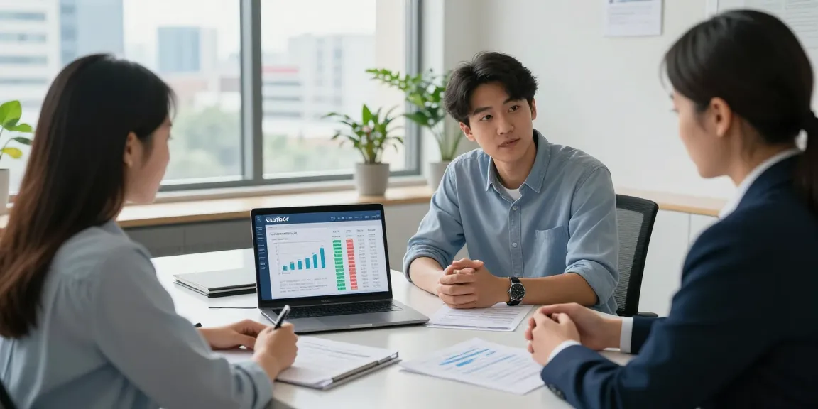Young couple using the calculador euribor with financial advisor in an office setting.